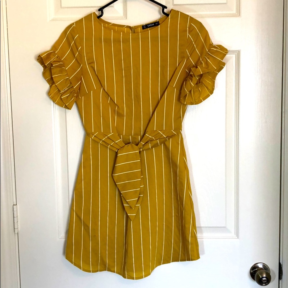 Gold linen striped mini dress with open back.